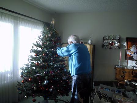 Dad putting up the tree