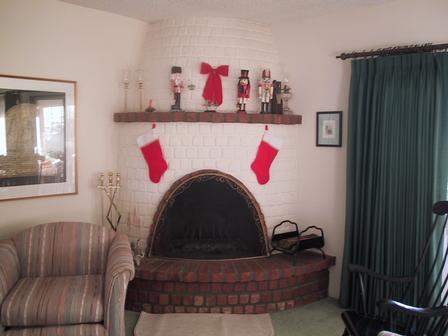 The fireplace, decorated for Christmas
