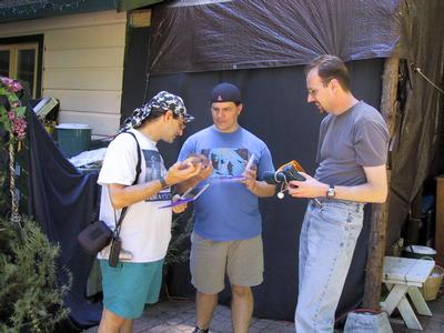 Neal Copperman, woj, and Jeff Hanson do what all ectophiles do when in the same place -- exchange CDs