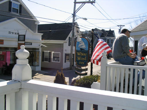 Standing on the inn's porch